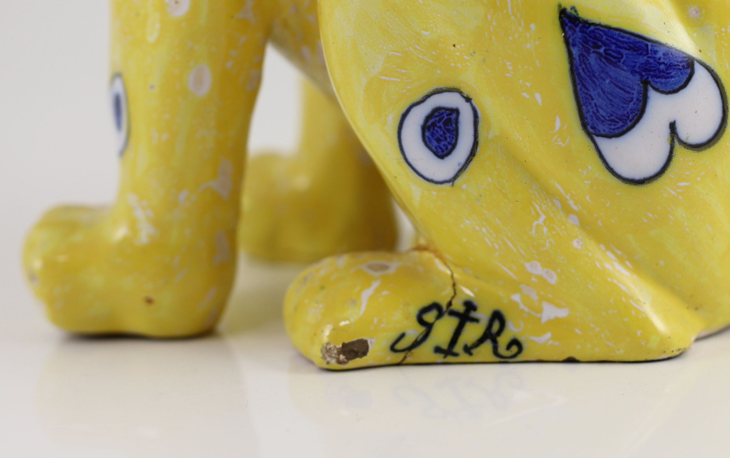 A Gallé yellow faience model of a seated smiling cat, c.1885, 33cm high, small faults